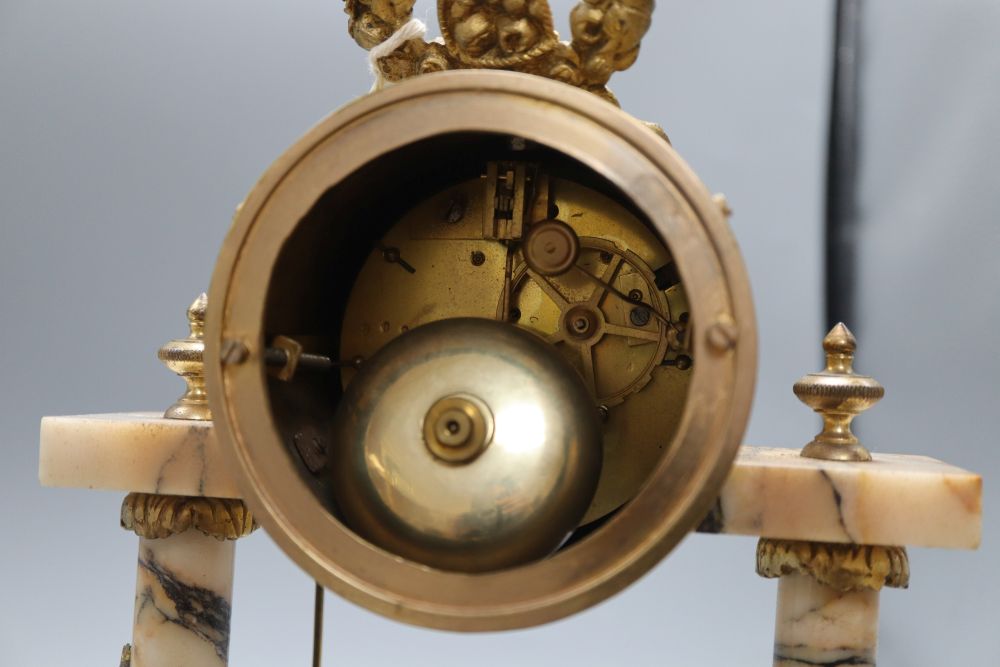 A French peach marble and gilt pillar clock, height 38cm